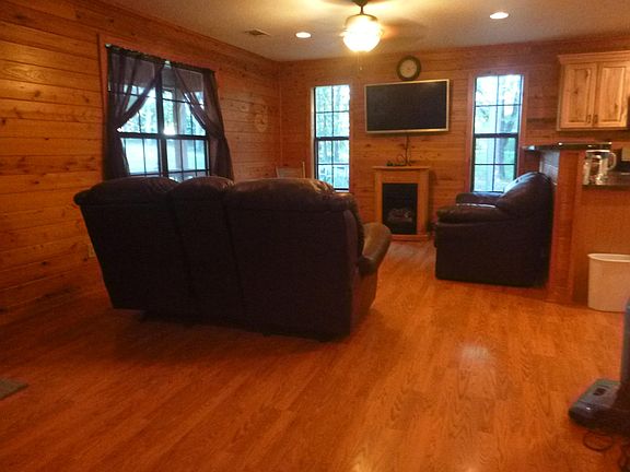 Living room. Couches and TV , satellite disc stay.