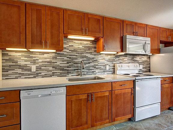 Kitchen/quartz counter/tile backsplash