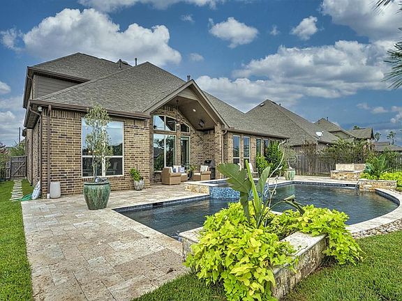 Imagine ending a long day right here. Relax in the spa or float in the pool just steps away in your own backyard.