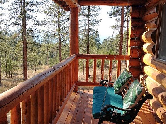 Porch swing at main floor deck.