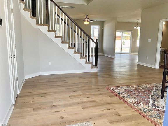 Enter into this light filled foyer with LVP throughout first floor