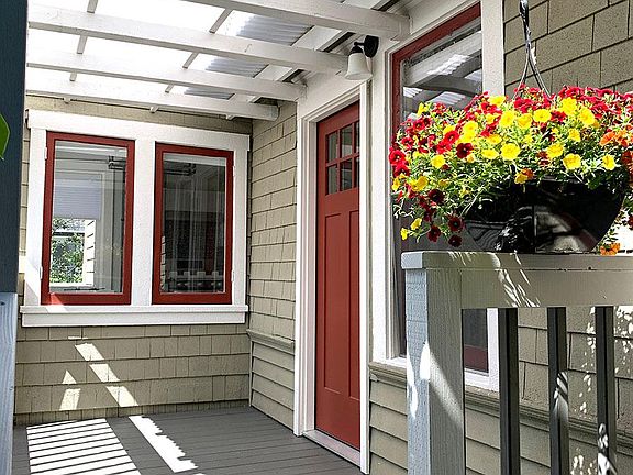 Private entrance with bright covered front porch, perfect for morning coffee.