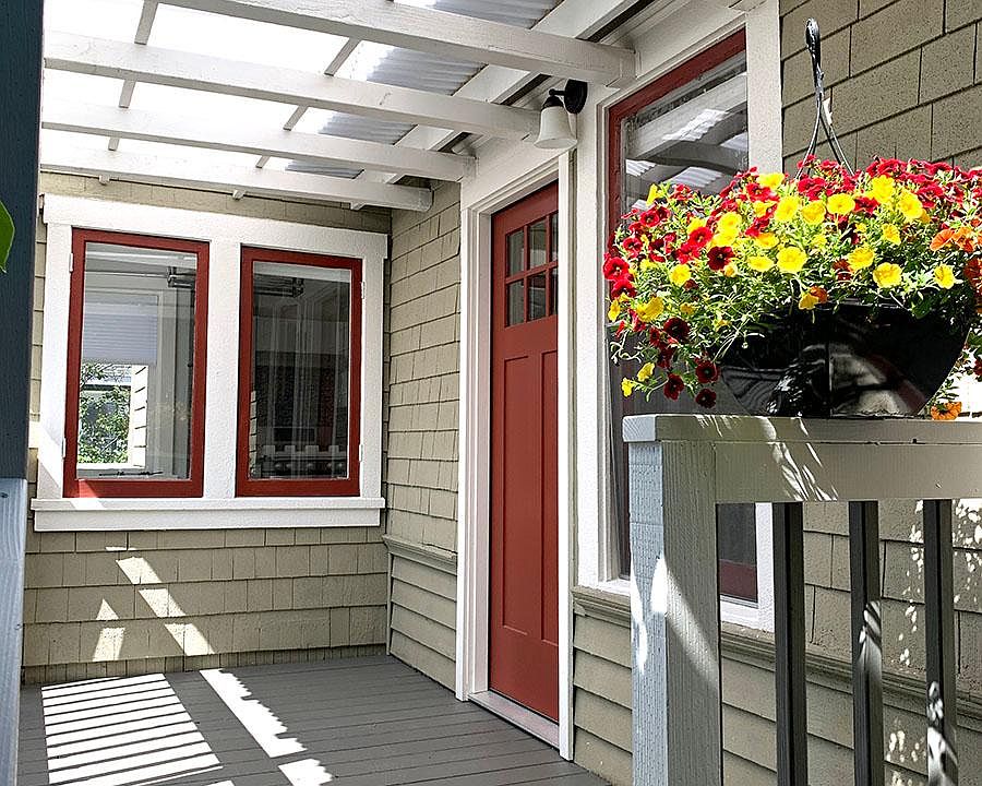 Private entrance with bright covered front porch, perfect for morning coffee.