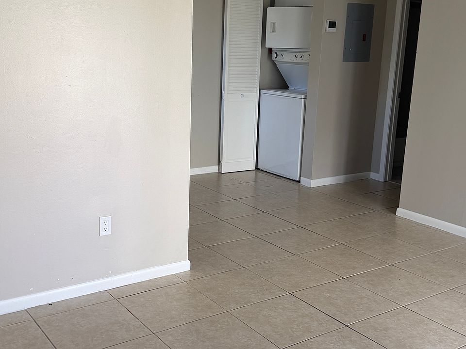 Living room looking towards bedroom with appliance closet open. Sorry about the hand obstruction.