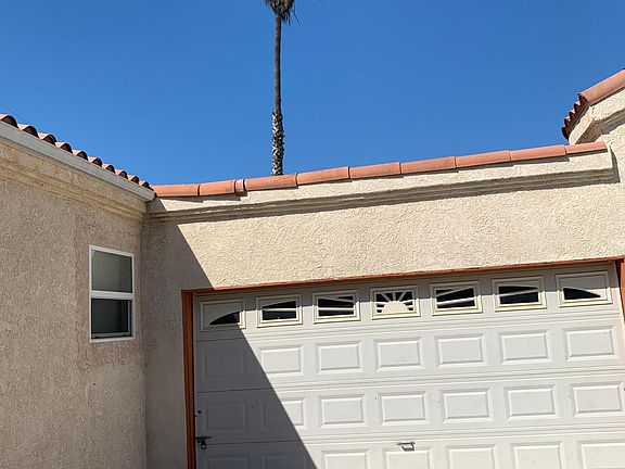 Attached Two-Car Garage with built-in shelves