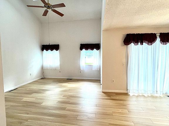 Spacious, bright and tall living room, brand new luxury vinyl plank flooring throughout. Skylights bring plenty of natural light.