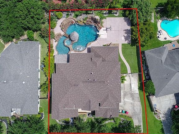 This aerial view of the property shows the wonderful size of the pool as well as the basketball pad. This lot is one of the larger properties in Seven Meadows!