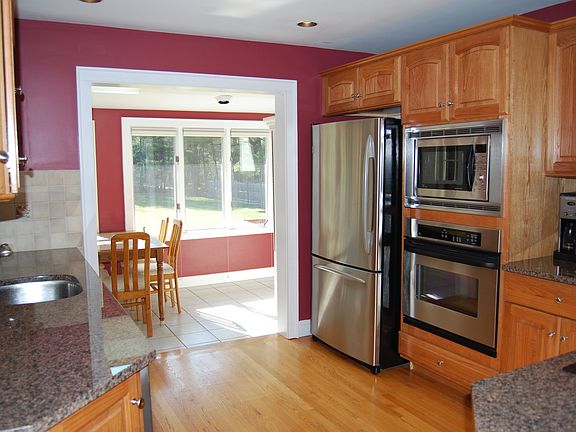 Kitchen looking into sunroom.