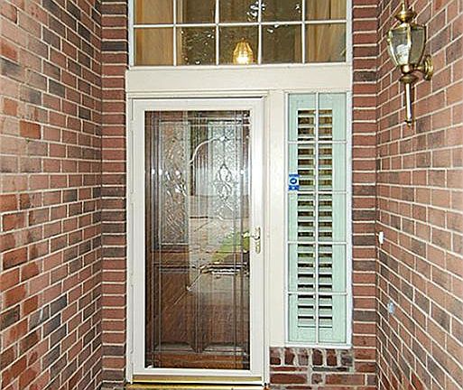 Gorgeous entry way with leaded glass front door.