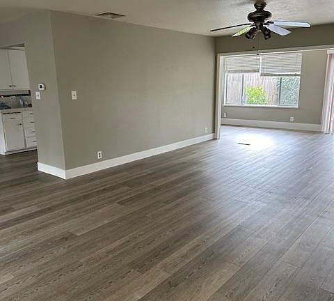 wrap around open space with kitchen, eating areas, and living room