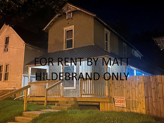 Front of house with patio and fenced in yard