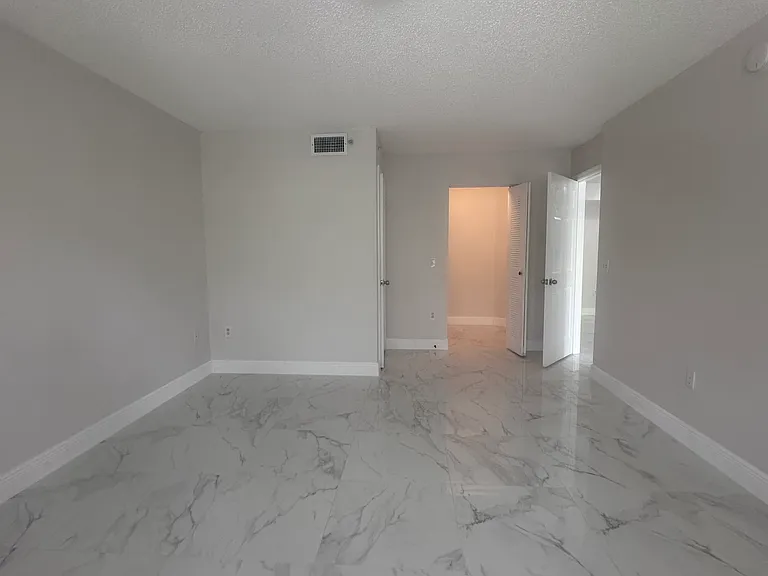 5011 Wiles Rd #207 — Photo 24