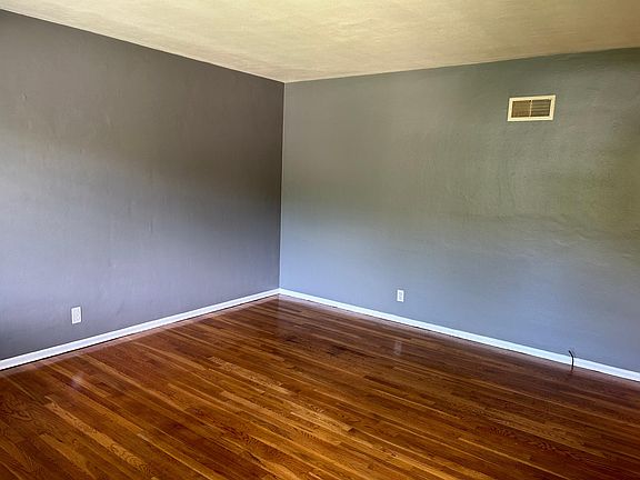Living Room- fresh paint and hardwood floors
