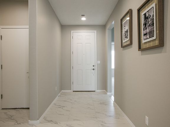 Gorgeous floor tile fills the common areas of the home.