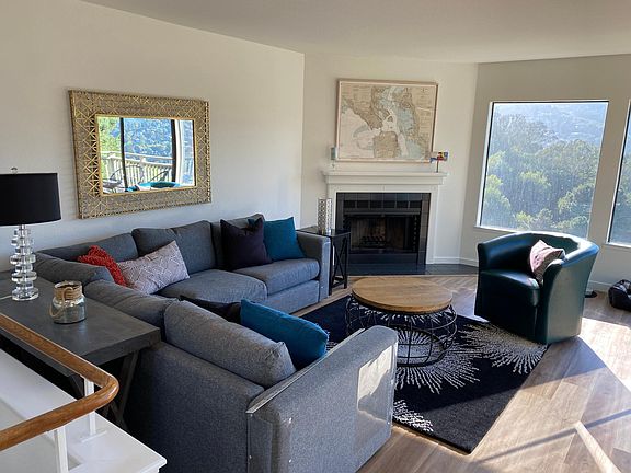 Upstairs living room. If wanted, we will install tv plug on wall above fireplace.