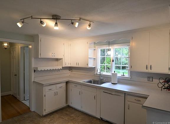 Kitchen with white hardwood...