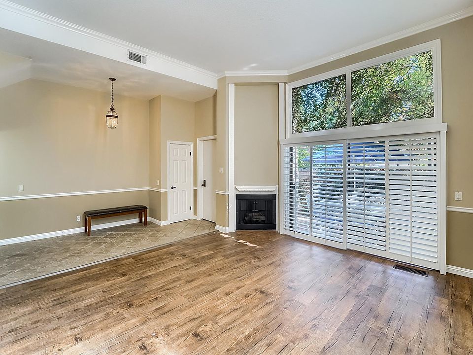 Living room towards front door and patio.
