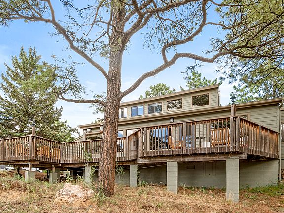 Large open deck, two seating areas, outside dining and grill.