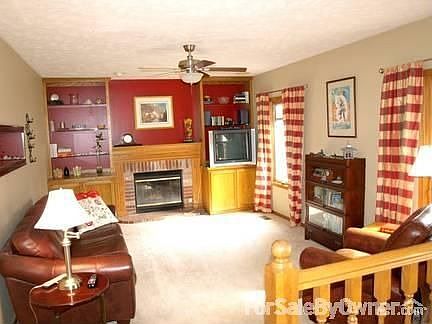 Family room : Step-down family room with custom cabinetry, gas log fireplace, and great light