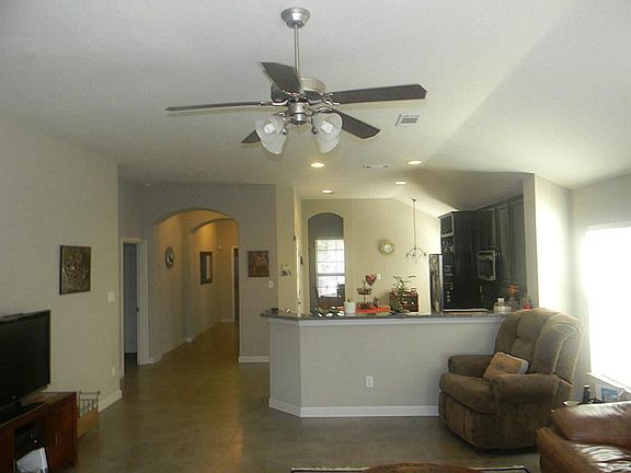 THE LIVING ROOM IS VERY SPACIOUS AND OPEN TO THE KITCHEN & B