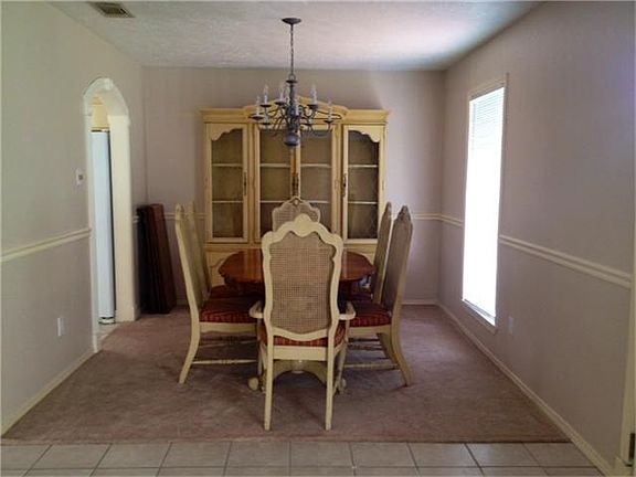 Formal Dining room with crown molding.