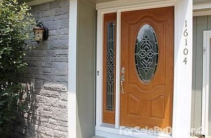 New Fiberglass Entry Door
						:
						Natural brick decorative siding