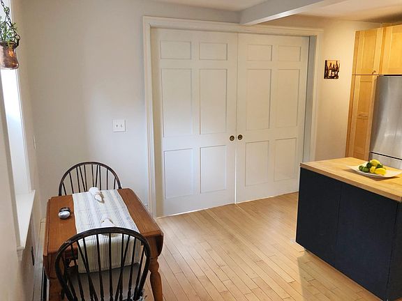 Pocket doors turn the family room into a private guest suite.