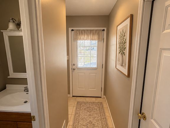 The entryway is very inviting with tile floors and neutral walls.