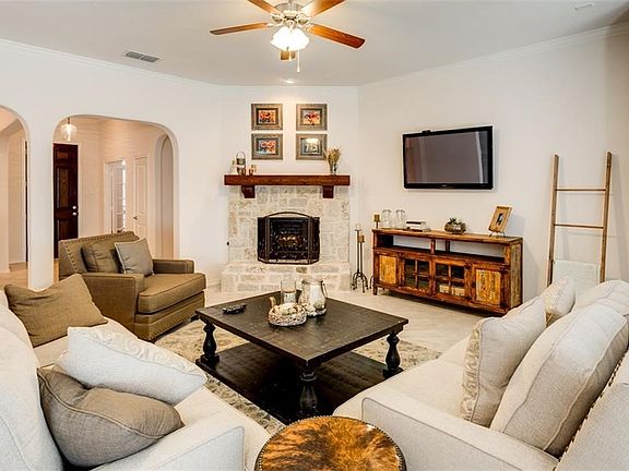 Light and bright, spacious family room with raised hearth, wood burning stone fireplace.