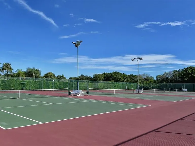 Lighted, clay tennis courts in front of and to side of the Clubhouse.