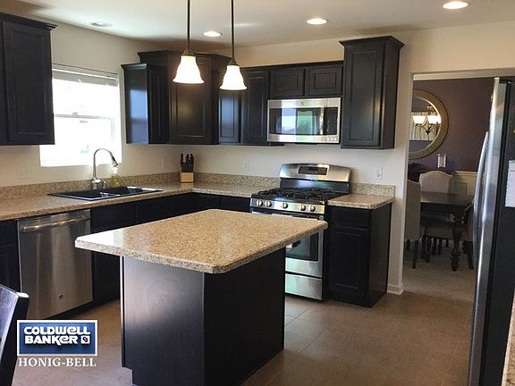 Kitchen includes upgraded countertops, lighting and stainless steel appliances.