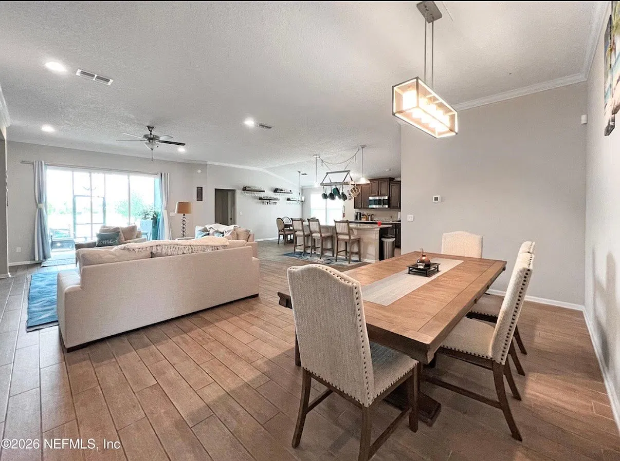 Five Bedrooms with four Baths, three car garage, a lake and a Lanai ready to he called home — Photo 4