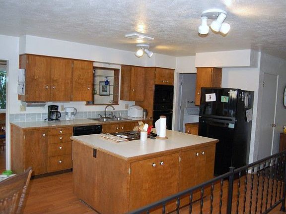 open kitchen with a large island and eating area