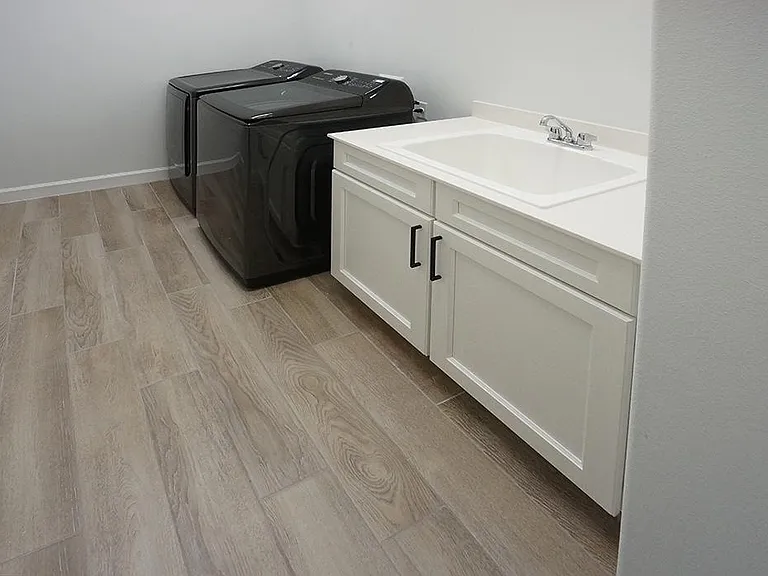 Laundry room with new washer & dryer