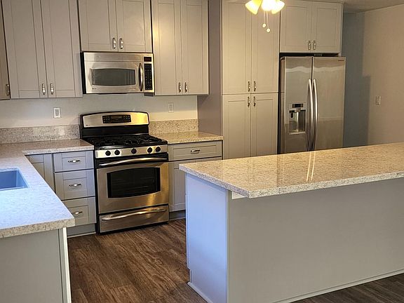 Kitchen-New Shaker Cabinets with Soft Close, New Quartz Counter tops, Center Island w/ cabinets and seating for 3 or 4 bar stools (not included)