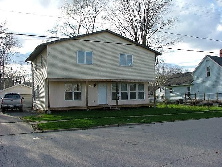 Front of house has covered porch