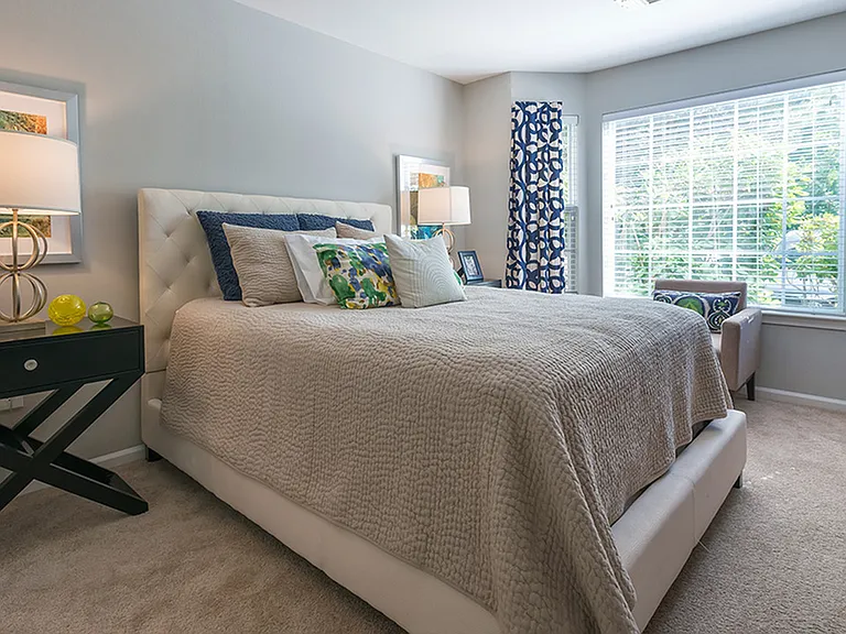 Brightly lit bedroom with ample closet space