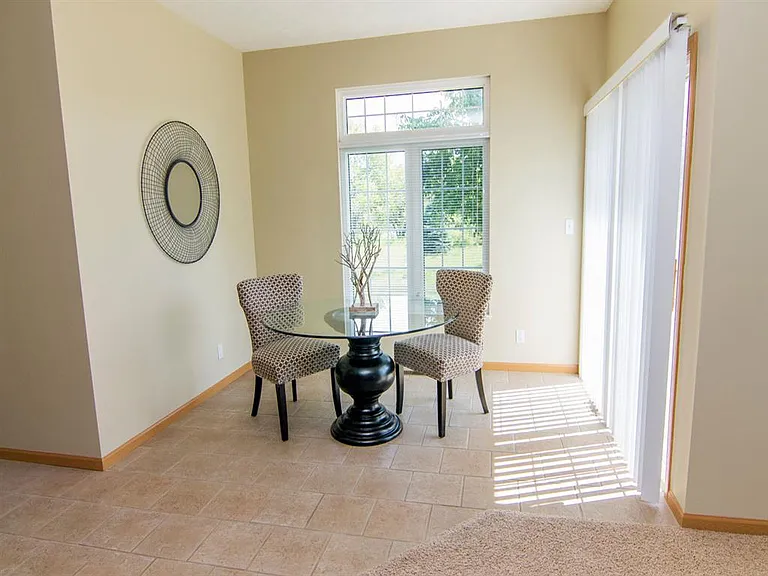 Our homes feature a spacious dining area with a sliding door leading to the deck.