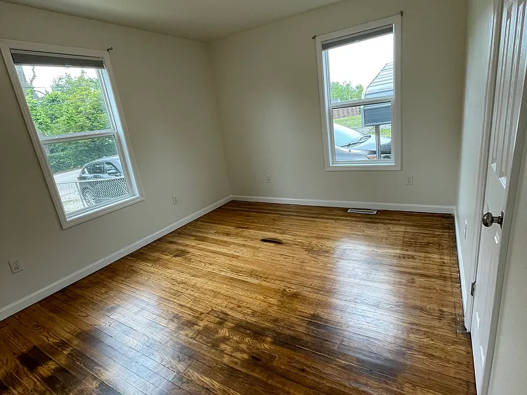 Front bedroom has two windows and a closet.