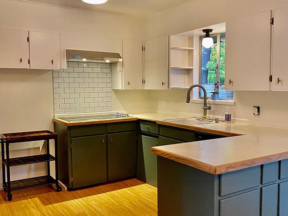 nicely updated kitchen, with a functional design great for prepping meals and opens to the dining area.
