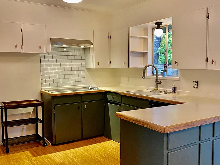 nicely updated kitchen, with a functional design great for prepping meals and opens to the dining area.