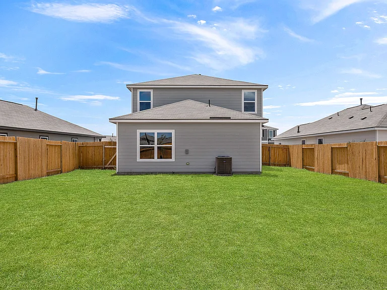 Private, fully fenced backyard.