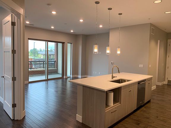 Kitchen and living room, with master bedroom door on left