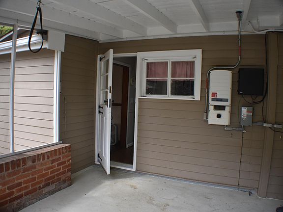 Screened porch with entry to kitchen