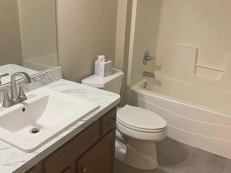 Guest bath with new floors, counters and
refinished tub/shower surround.