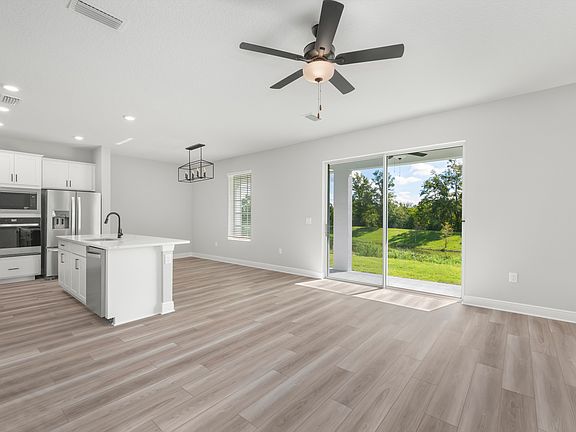 Family room with a sliding door to the back yard