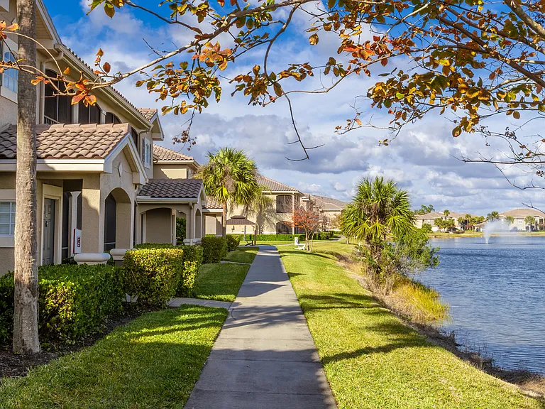 Stroll along peaceful lakeside walking paths surrounded by lush greenery and breathtaking water views.