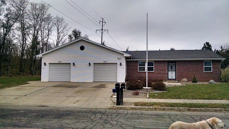 Curbside View
						:
						Garages and Unit 2 Entrance Face South