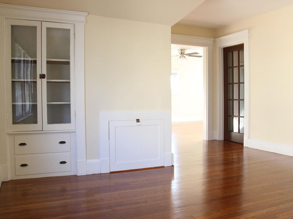 Bright and open space with original built-ins! Note: Front and rear doors replaced with white painted metal fire resistant doors after picture taken.