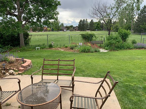 The backyard has open grounds beyond the fence which adds privacy to the property. What a bonus